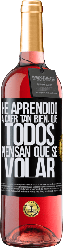 29,95 € Envío gratis | Vino Rosado Edición ROSÉ He aprendido a caer tan bien, que todos piensan que sé volar Etiqueta Negra. Etiqueta personalizable Vino joven Cosecha 2024 Tempranillo