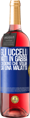 29,95 € Spedizione Gratuita | Vino rosato Edizione ROSÉ Gli uccelli nati in gabbia credono che volare sia una malattia Etichetta Blu. Etichetta personalizzabile Vino giovane Raccogliere 2024 Tempranillo