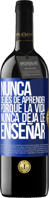 39,95 € Envío gratis | Vino Tinto Edición RED MBE Reserva Nunca dejes de aprender porque la vida nunca deja de enseñar Etiqueta Azul. Etiqueta personalizable Reserva 12 Meses Cosecha 2015 Tempranillo