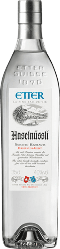 53,95 € Envio grátis | Aguardente Orujo Etter Söehne Haselnüssli Suíça Garrafinha Terço 35 cl Haselnuss — Avelã