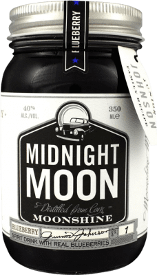 22,95 € Envio grátis | Licores Midnight Moon Moonshine Blueberry Estados Unidos Garrafa Terço 35 cl