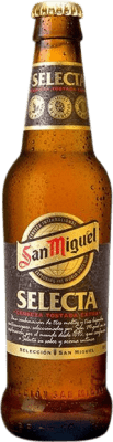 42,95 € 免费送货 | 盒装24个 啤酒 San Miguel Selecta Tostada — 琥珀色啤酒 安达卢西亚 西班牙 三分之一升瓶 33 cl 可回收玻璃