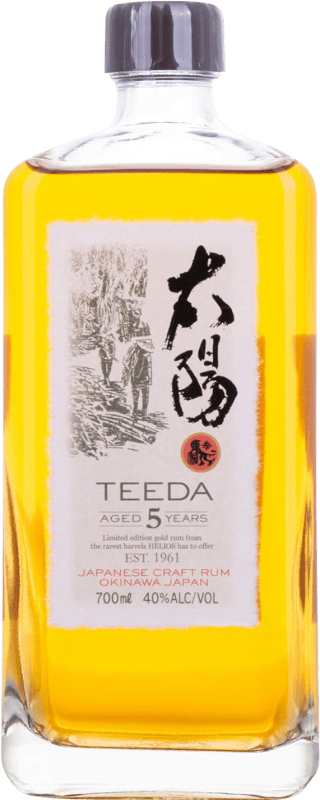 129,95 € Spedizione Gratuita | Rum Helios Okinawa Teeda Aged Japanese Rum 5 Anni Bottiglia 70 cl