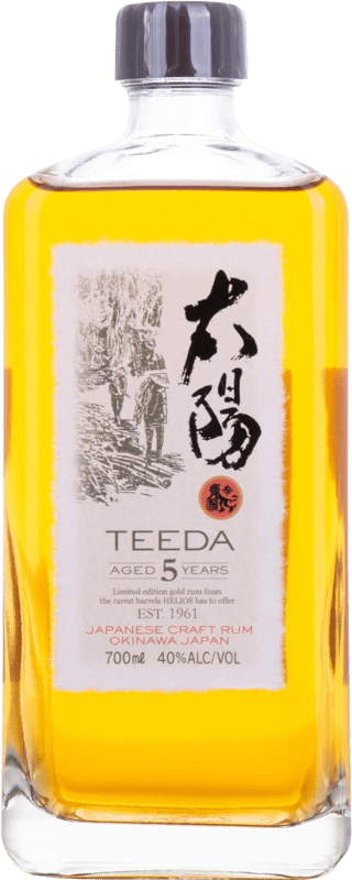 109,95 € Kostenloser Versand | Rum Helios Okinawa Teeda Aged Japanese Rum 5 Jahre Flasche 70 cl