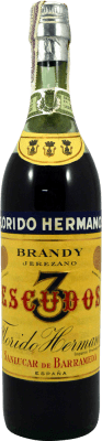 178,95 € Envio grátis | Brandy Conhaque Hermanos Florido 3 Escudos Espécime de Colecionador década de 1970 Espanha Garrafa 75 cl